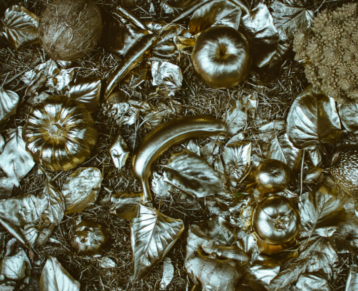 An image depicting titanium gold jewelry under different lighting conditions