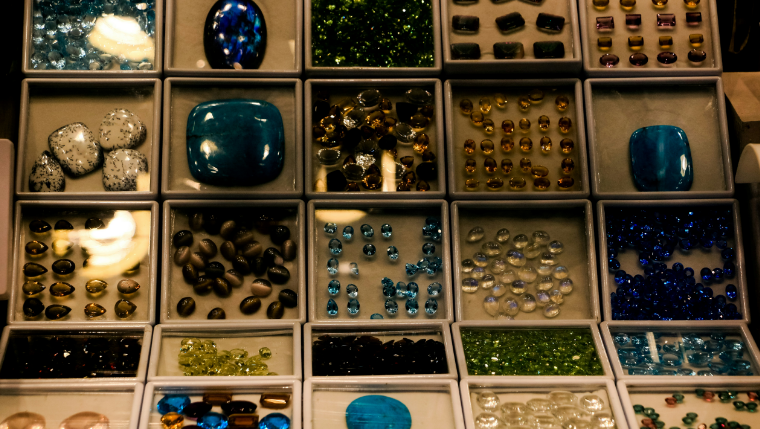 Image of a neatly organized jewelry box with separate compartments