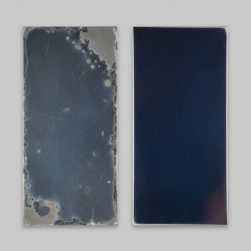 Close up of worn vs new MMO coating on titanium