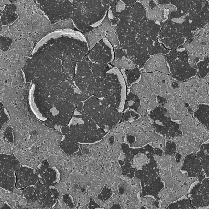 Microscopic view of worn MMO coating on titanium substrate