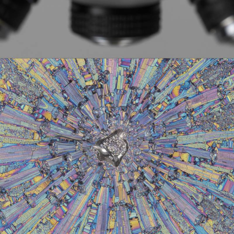 Cross-section of titanium armor plate after high velocity impact showing microscopic grain structure changes Cross-section of titanium armor plate after high velocity impact showing microscopic grain structure changes