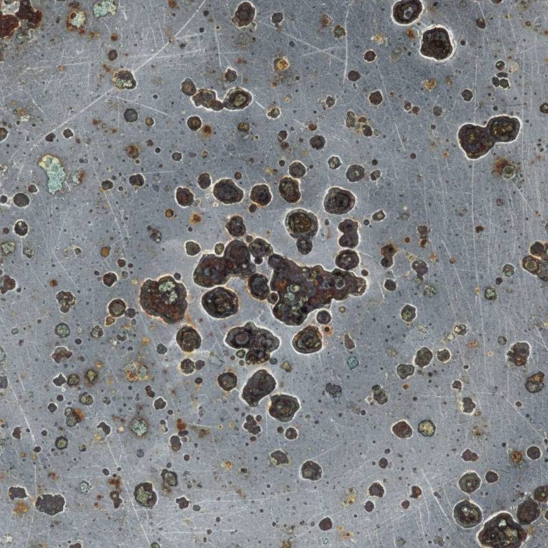 Microscopic view of pitting corrosion on metal surface Microscopic view of pitting corrosion on metal surface